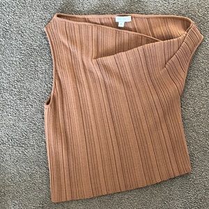 The Sei knit top, asymmetrical as it dips off one shoulder